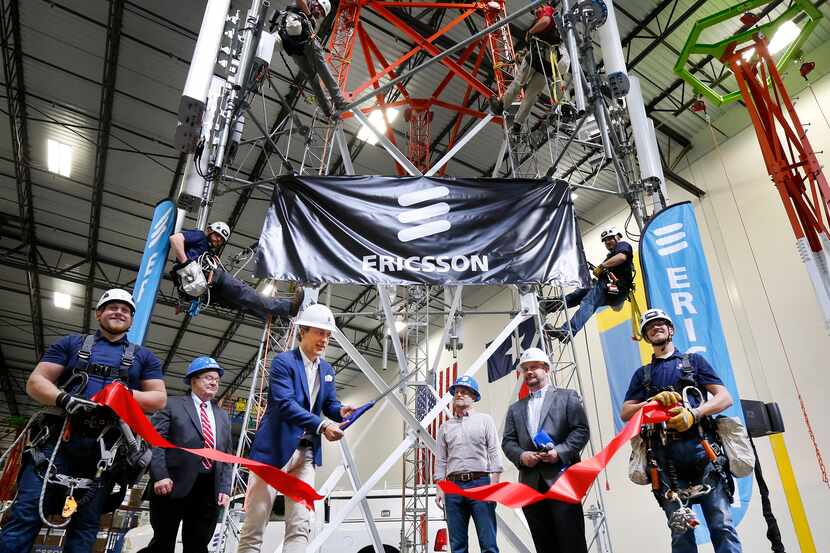 Ericsson's North American CEO Niklas Heuveldop (third from left) cut the ribbon on the new...