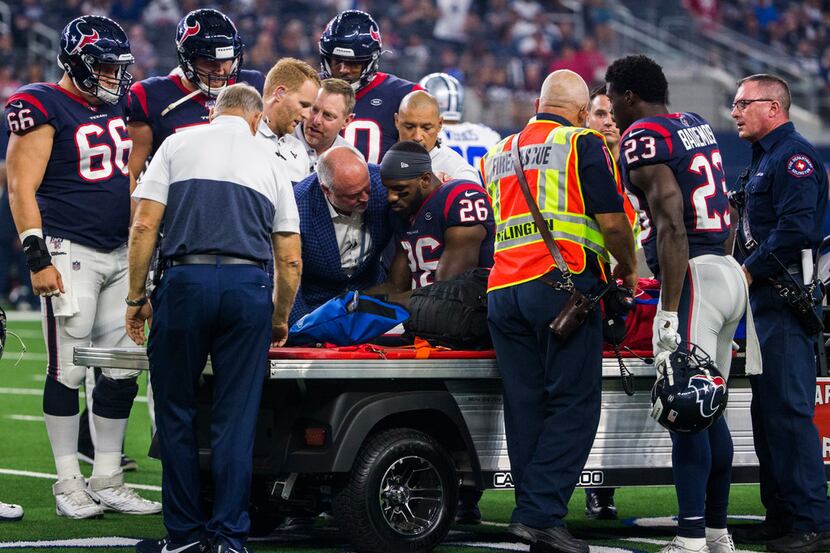 Houston Texans running back Lamar Miller (26) is injured during the first quarter of an NFL...