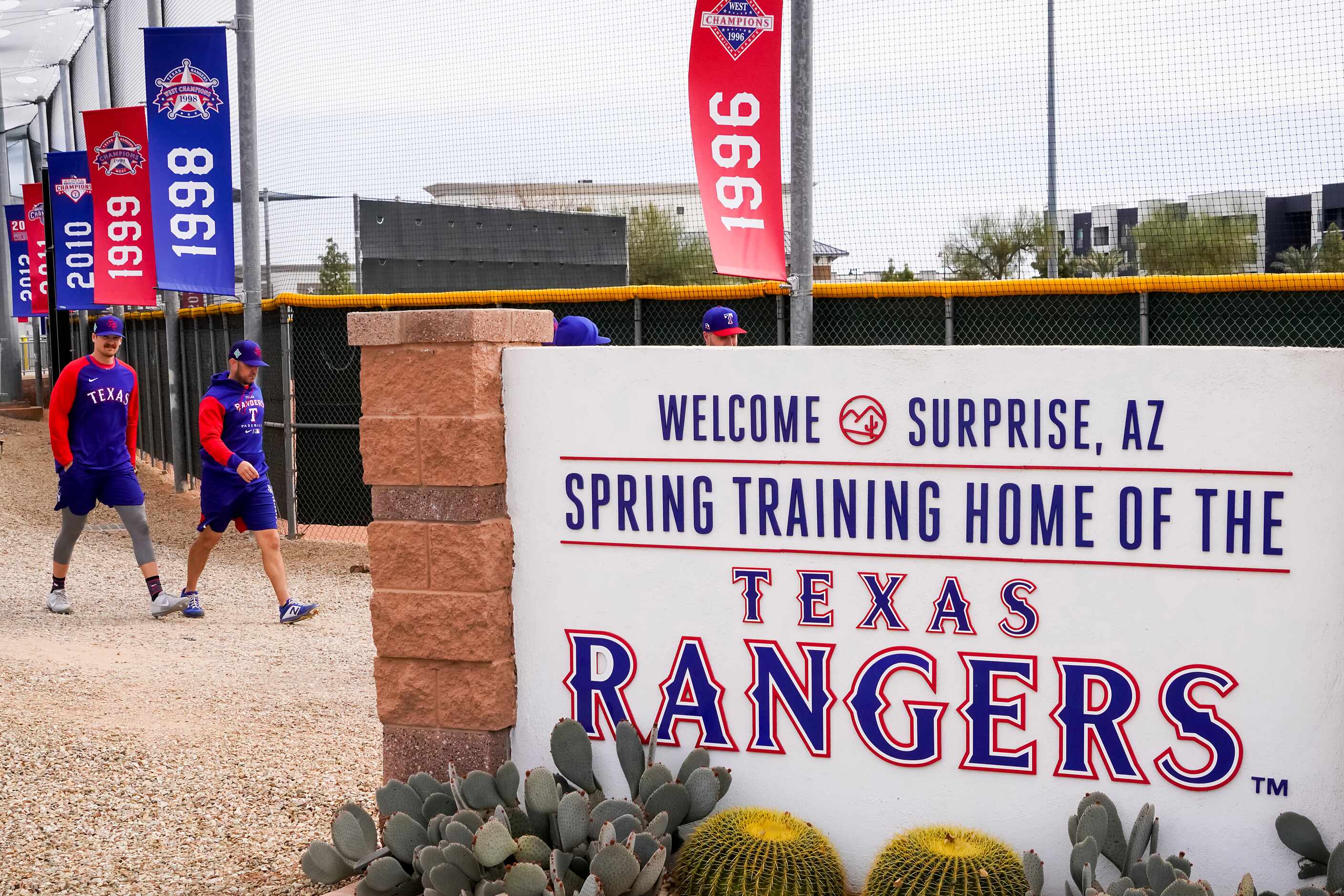 Players head to the practice fields before the Texas Rangers first minor league spring...