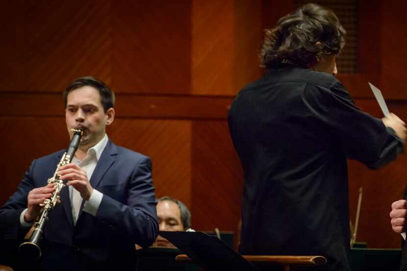 Clarinetist Stanislav Chernyshev, left, guest conductor Henrik Nánási and bass Kevin...