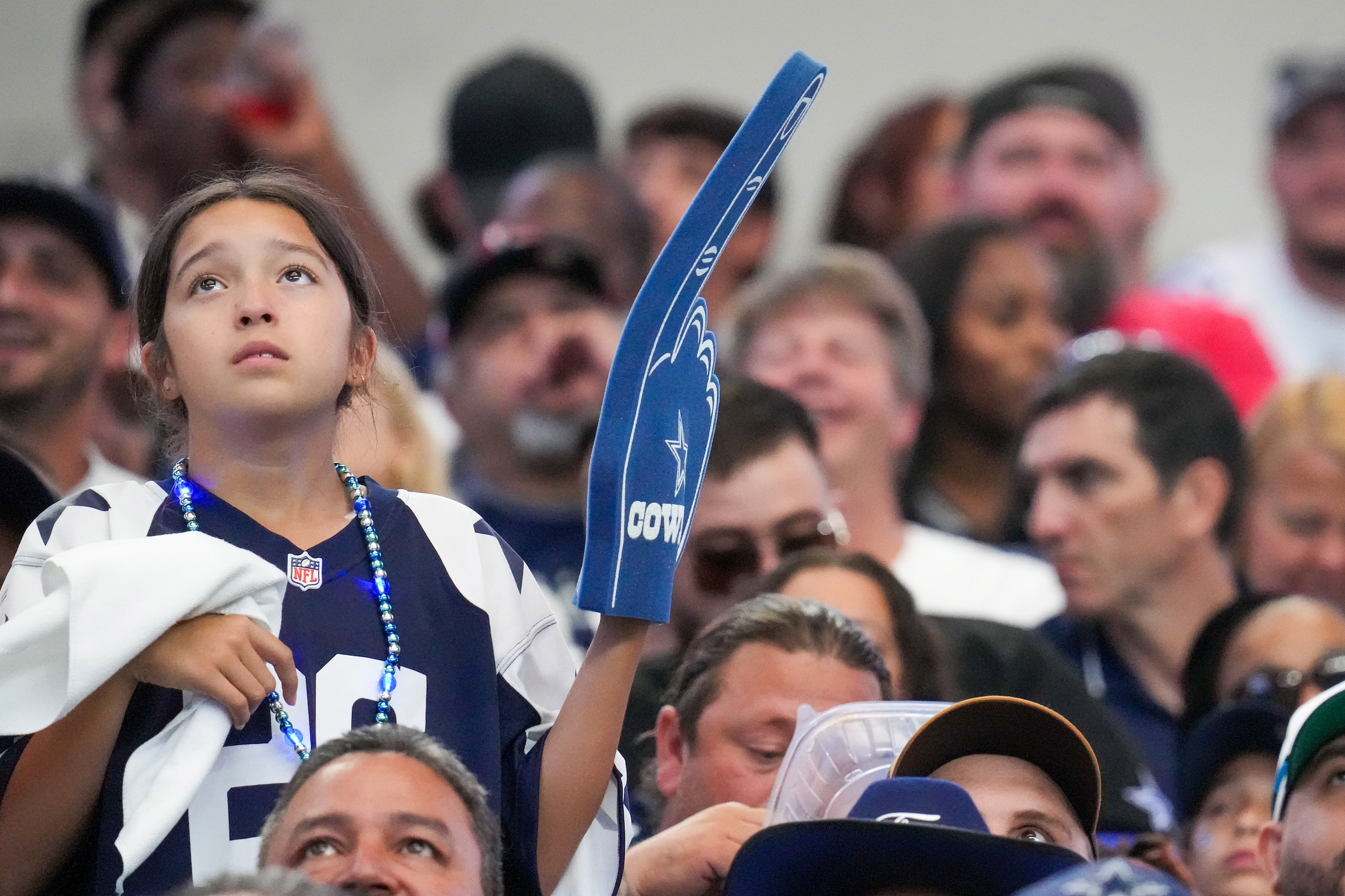 Dallas Cowboys fans look on after a touchdown  by Detroit Lions tight end Sam LaPorta during...