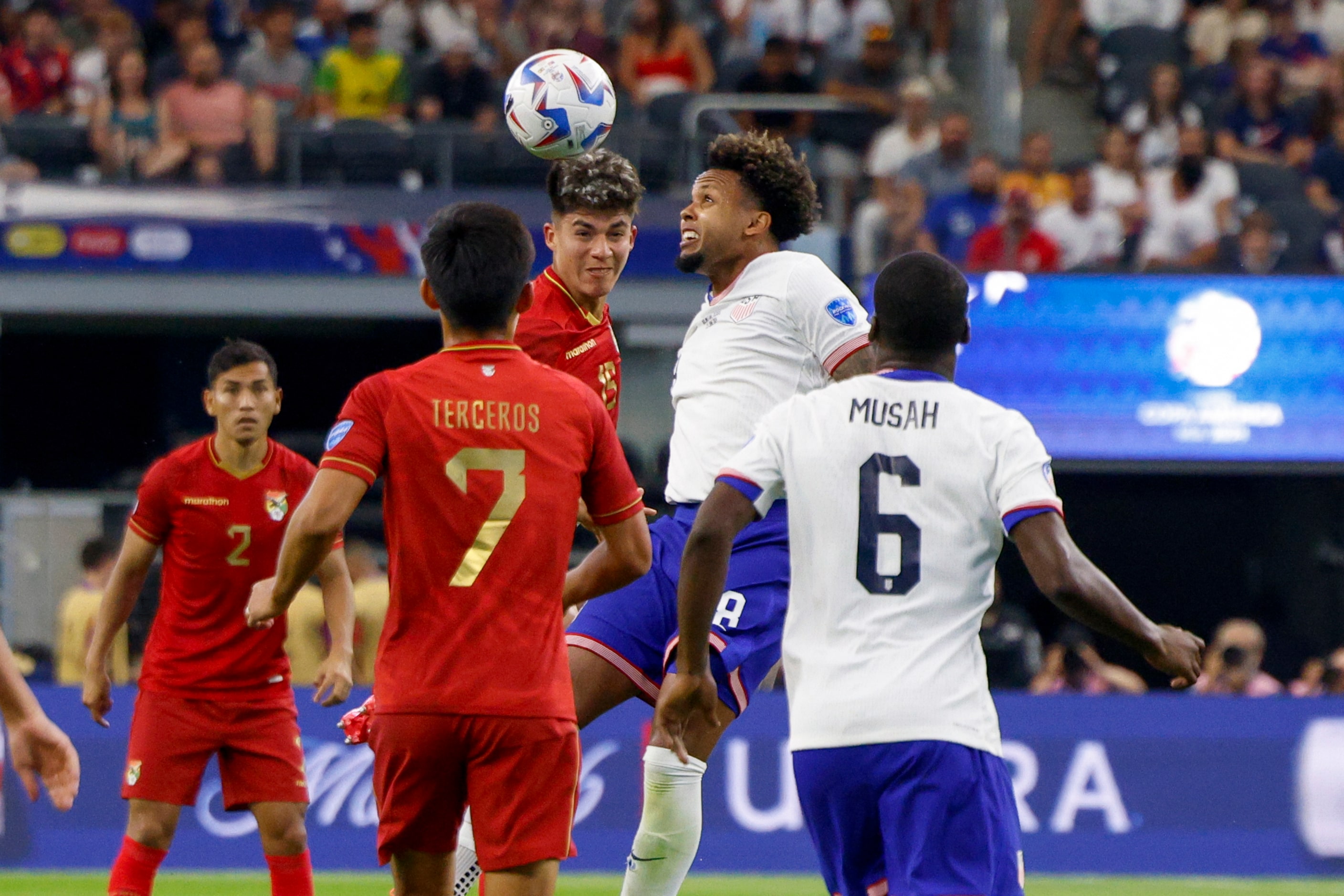 Bolivia midfielder Gabriel Villamíl (15) and United States midfielder Weston McKennie (8)...