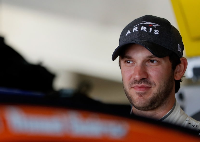 HAMPTON, GA - FEBRUARY 24:  Daniel Suarez, driver of the #19 ARRIS Toyota, stands in the...