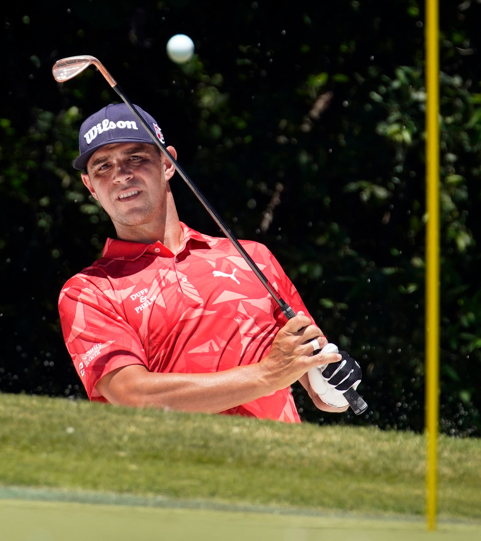 PGA Tour golfer Gary Woodland hits out of the No. 5 green side bunker during the final round...