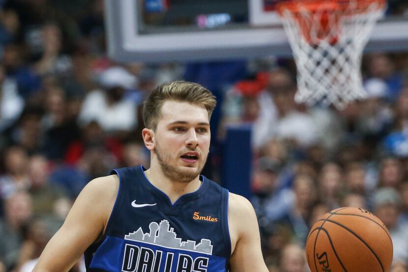 Dallas Mavericks forward Luka Doncic (77) drives downcourt during the second half a game...