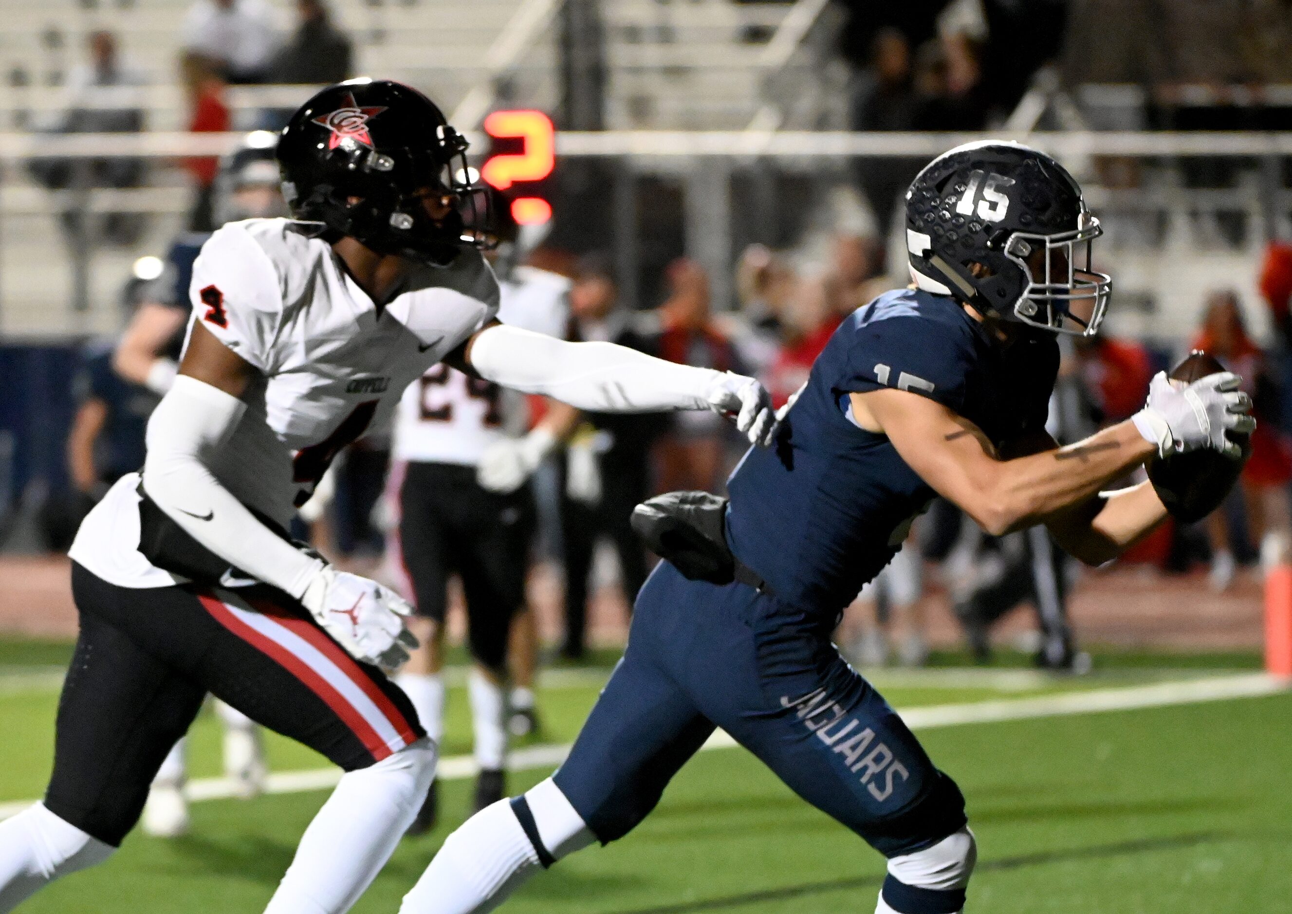 Flower Mound's Walker Mulkey (15) catches a touchdown pass in front of Coppell's Braxton...