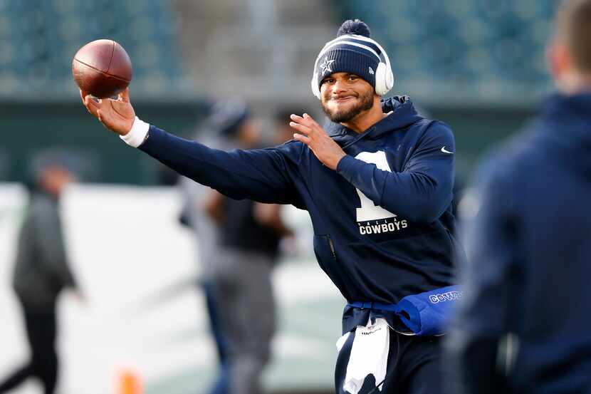 Dallas Cowboys quarterback Dak Prescott (4) throws the ball before warmups prior to a game...