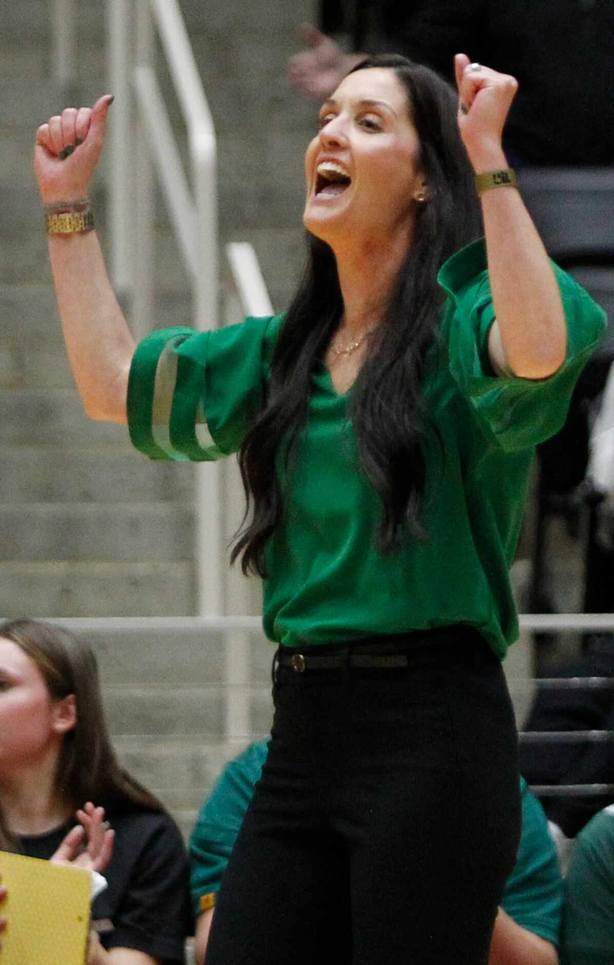 Prosper head coach Ashlee McCormick celebrates an Eagles point during the first set of their...