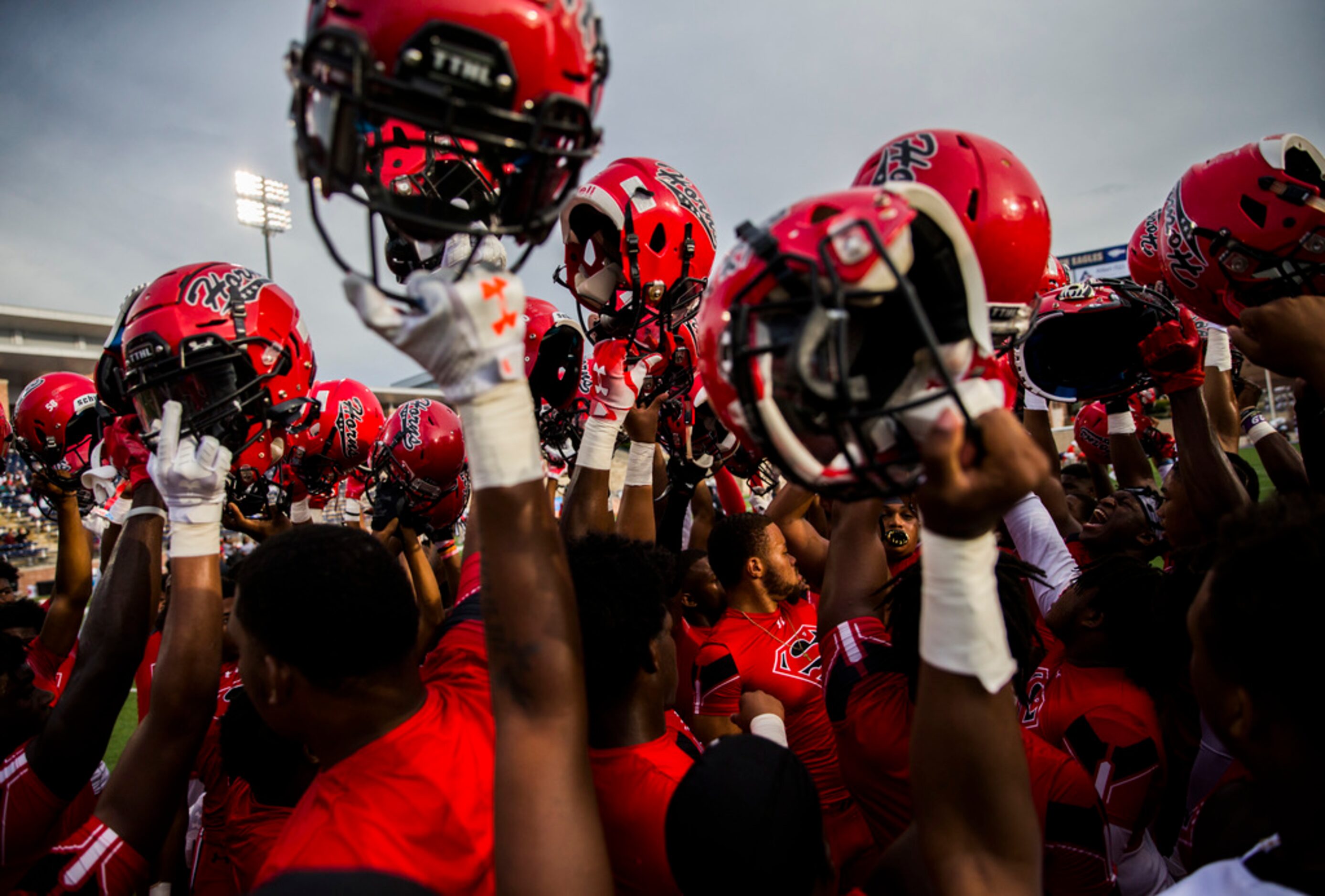 Cedar Hill football players rally before a high school football game between Allen and Cedar...