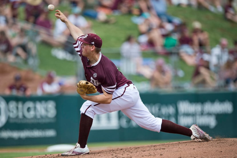 Texas A&M pitcher Stephen Kolek (32) throws during the first inning of a college baseball...
