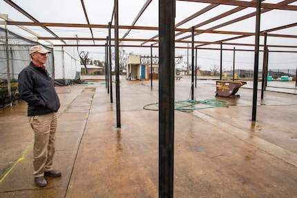 Owner Jon Pinkus stands among the structural remains of North Haven Gardens. 