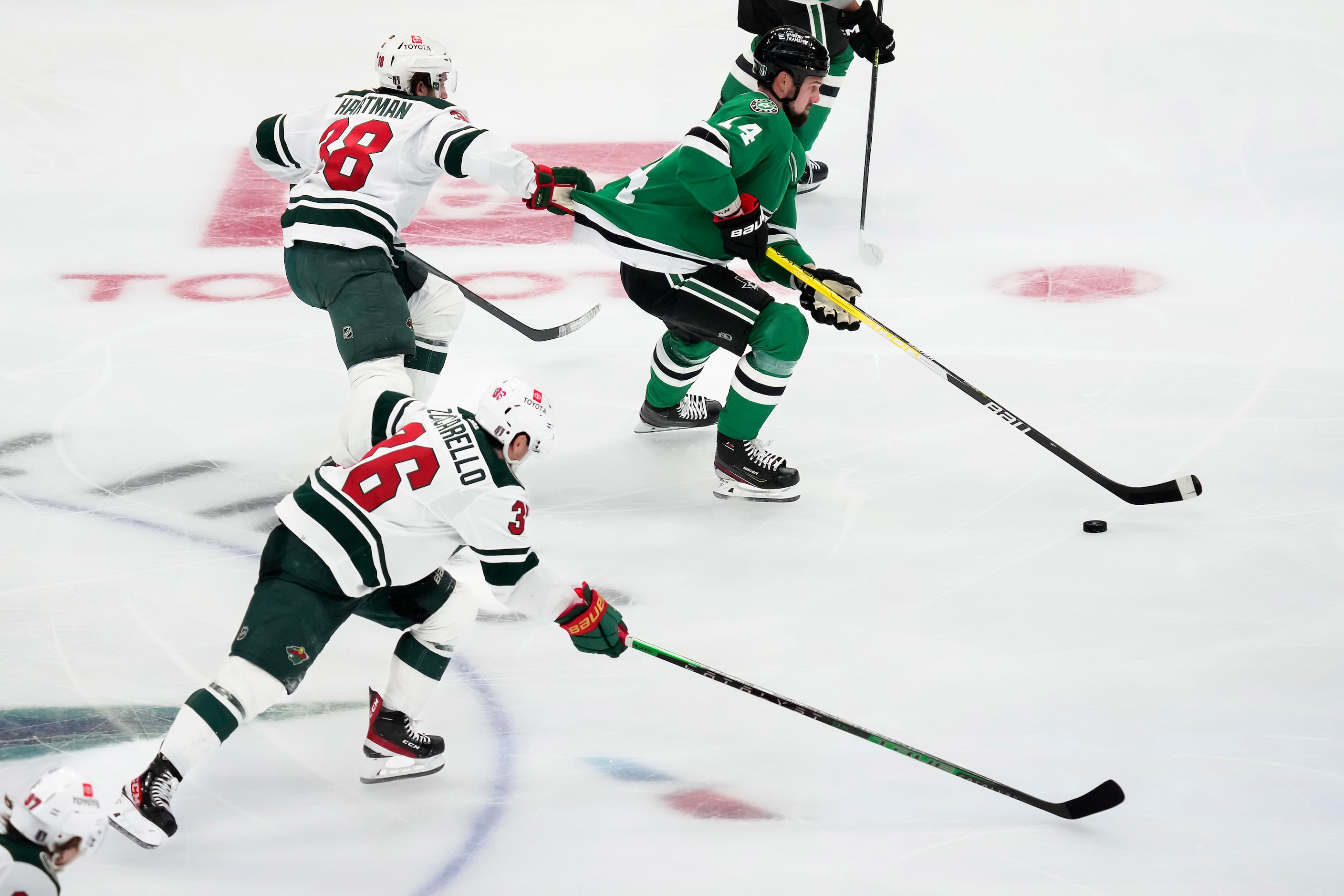 Minnesota Wild center Gustav Nyquist (28) tries to slow down Dallas Stars left wing Jamie...