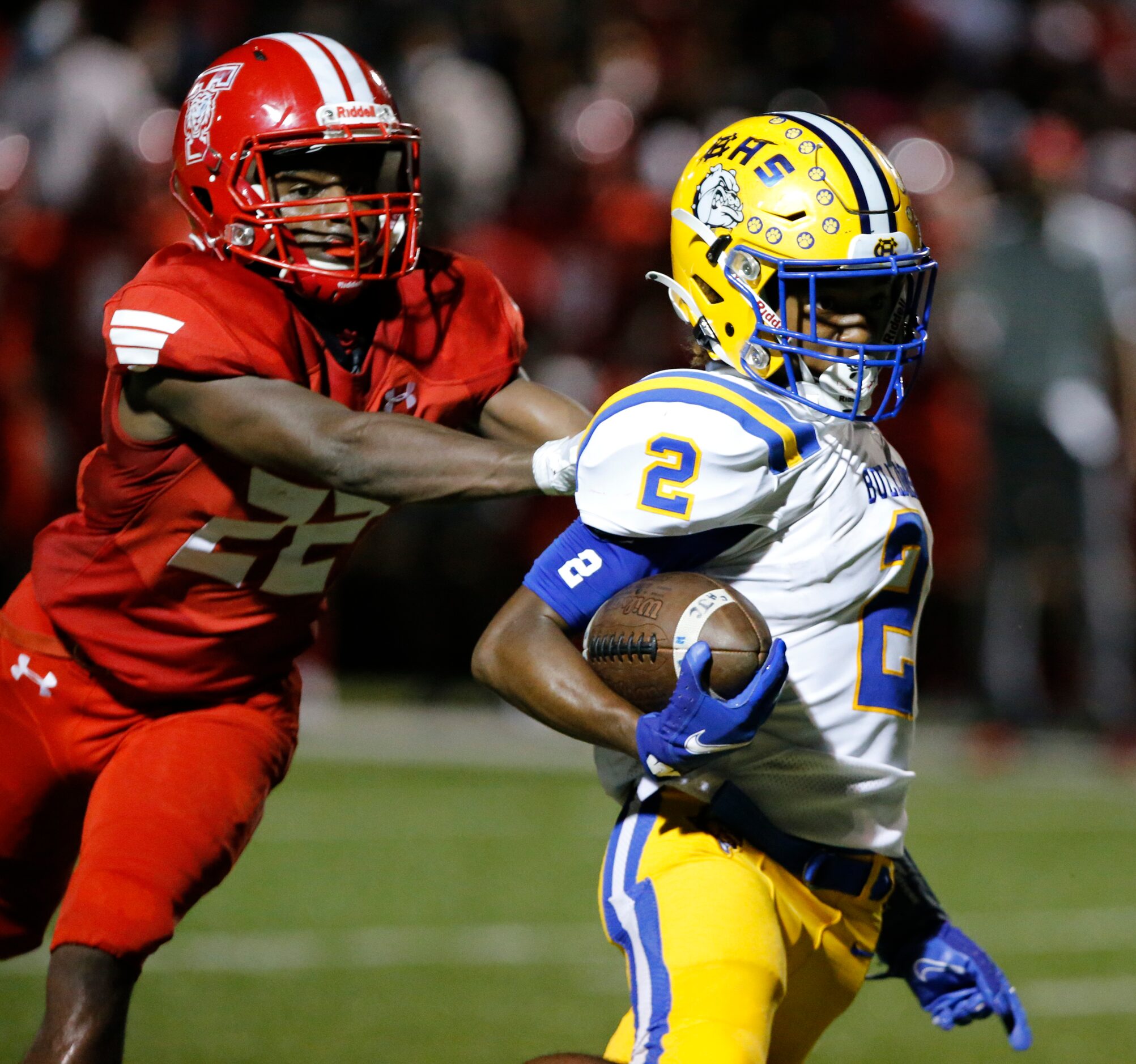 Terrell defender Shane Harris (22) grabs Chapel HillÕs Ilonzo McGregor (2) during the first...