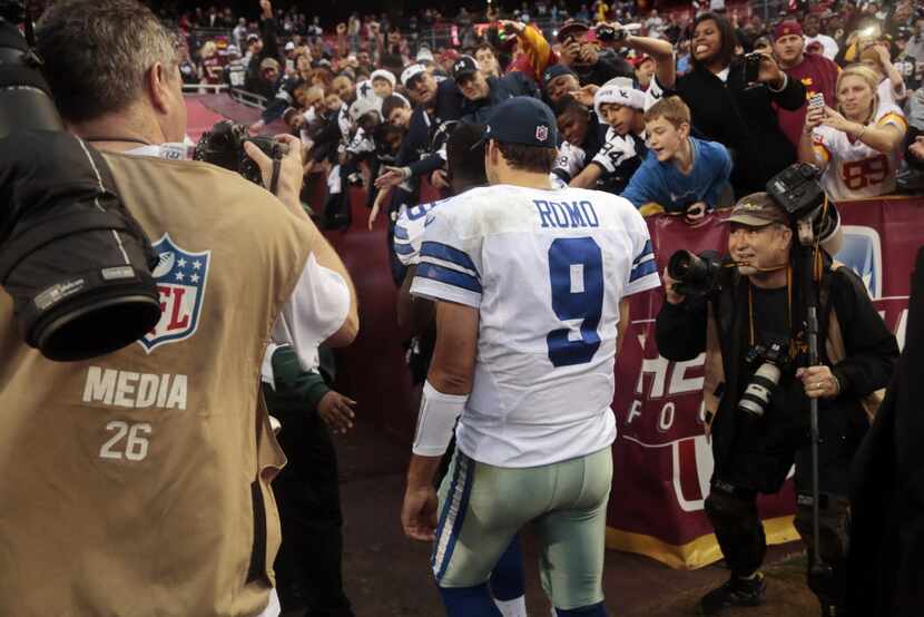 Quarterback Tony Romo leave the field after the Dallas Cowboys defeated the Washington...