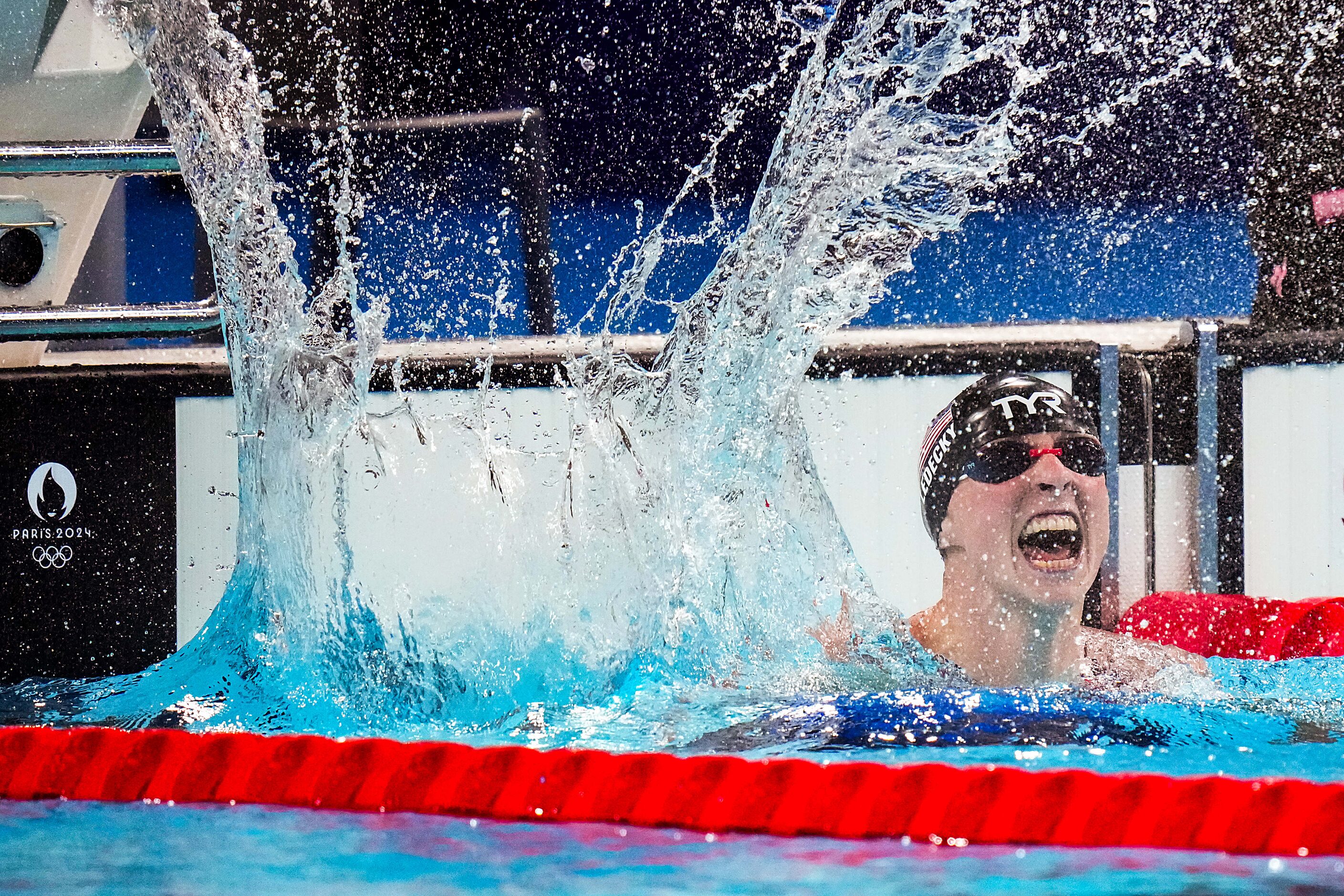 Katie Ledecky of the United States celebrates after winning the women's 1500-meter freestyle...