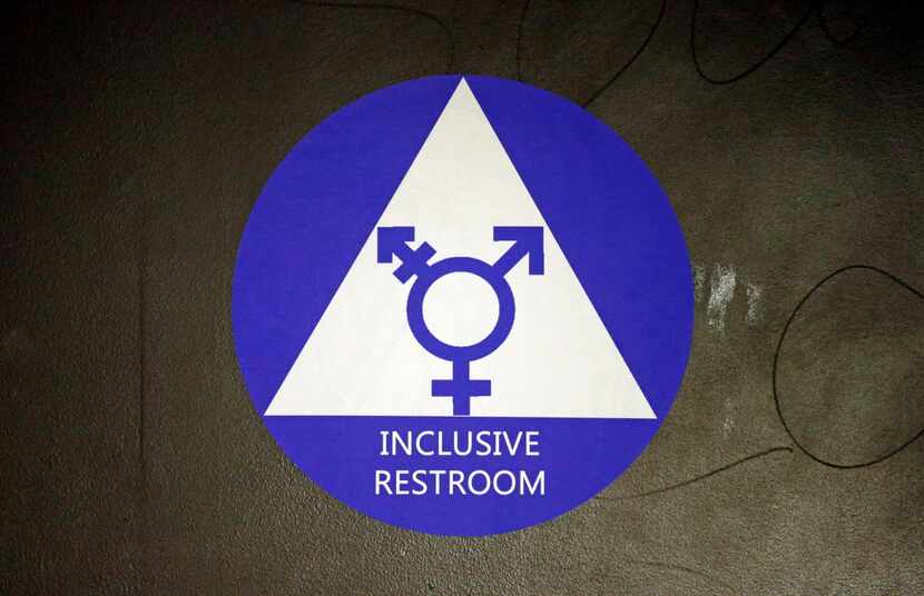  A new sticker designates a gender neutral bathroom at Nathan Hale High School Tuesday, May...