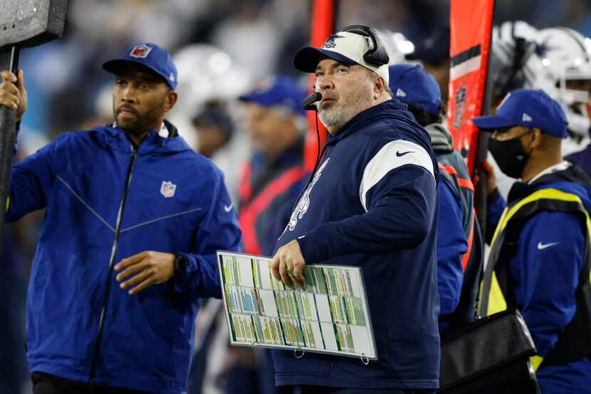 Dallas Cowboys head coach Mike McCarthy watches a replay during the first half of an NFL...