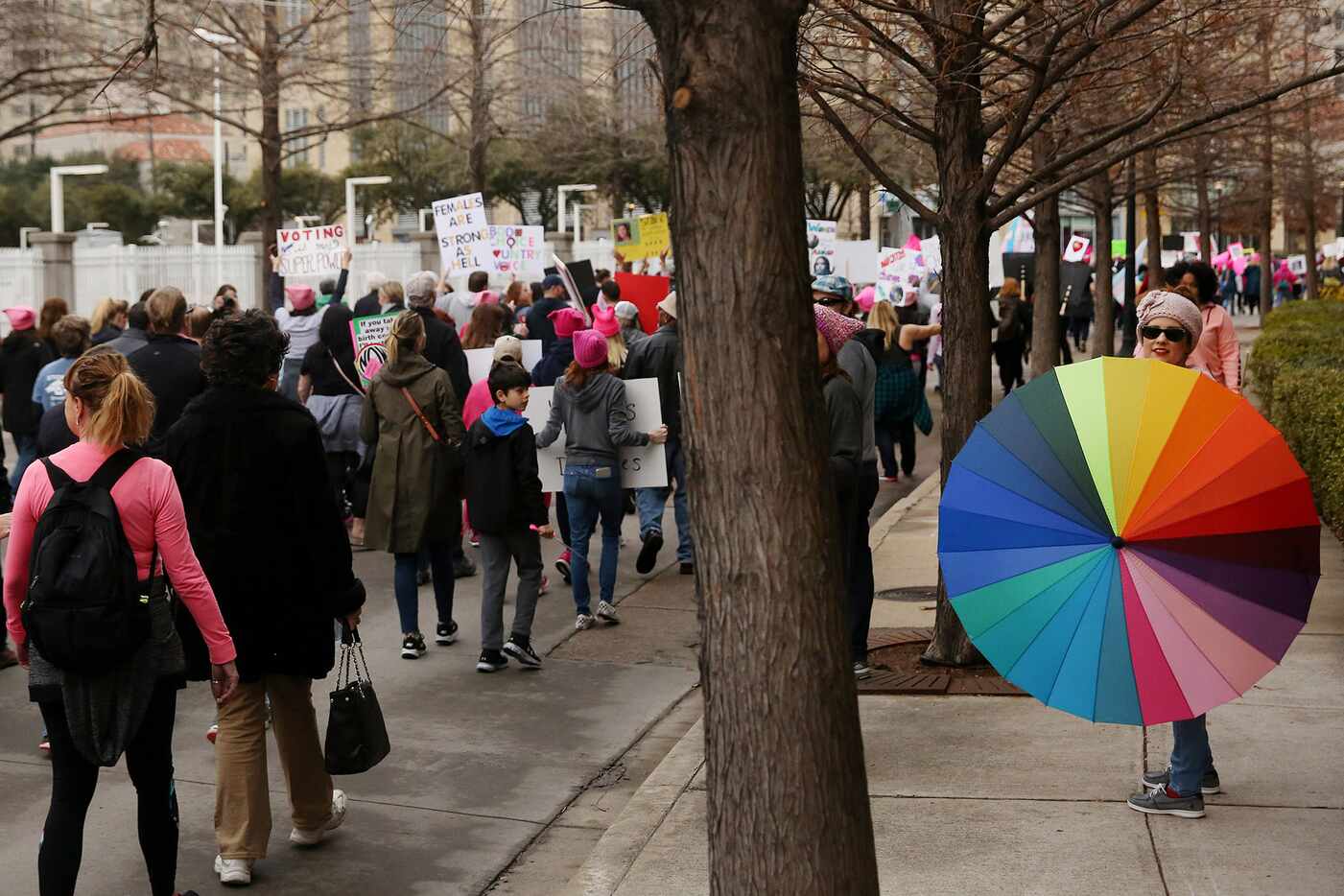 Marchers move Uptown during the Dallas Women's March in Dallas Saturday January 20, 2018....
