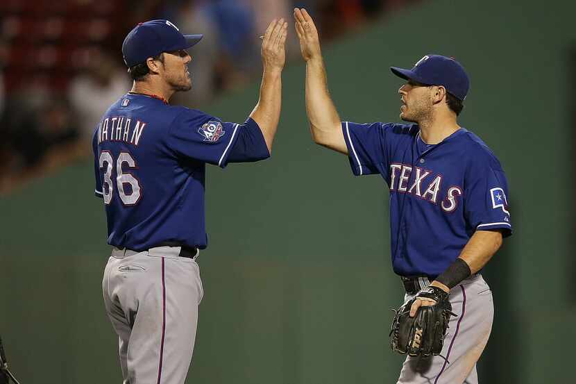 BOSTON, MA - AUGUST 7: Ian Kinsler #5 of the Texas Rangers celebrates a 6-3 win with Joe...