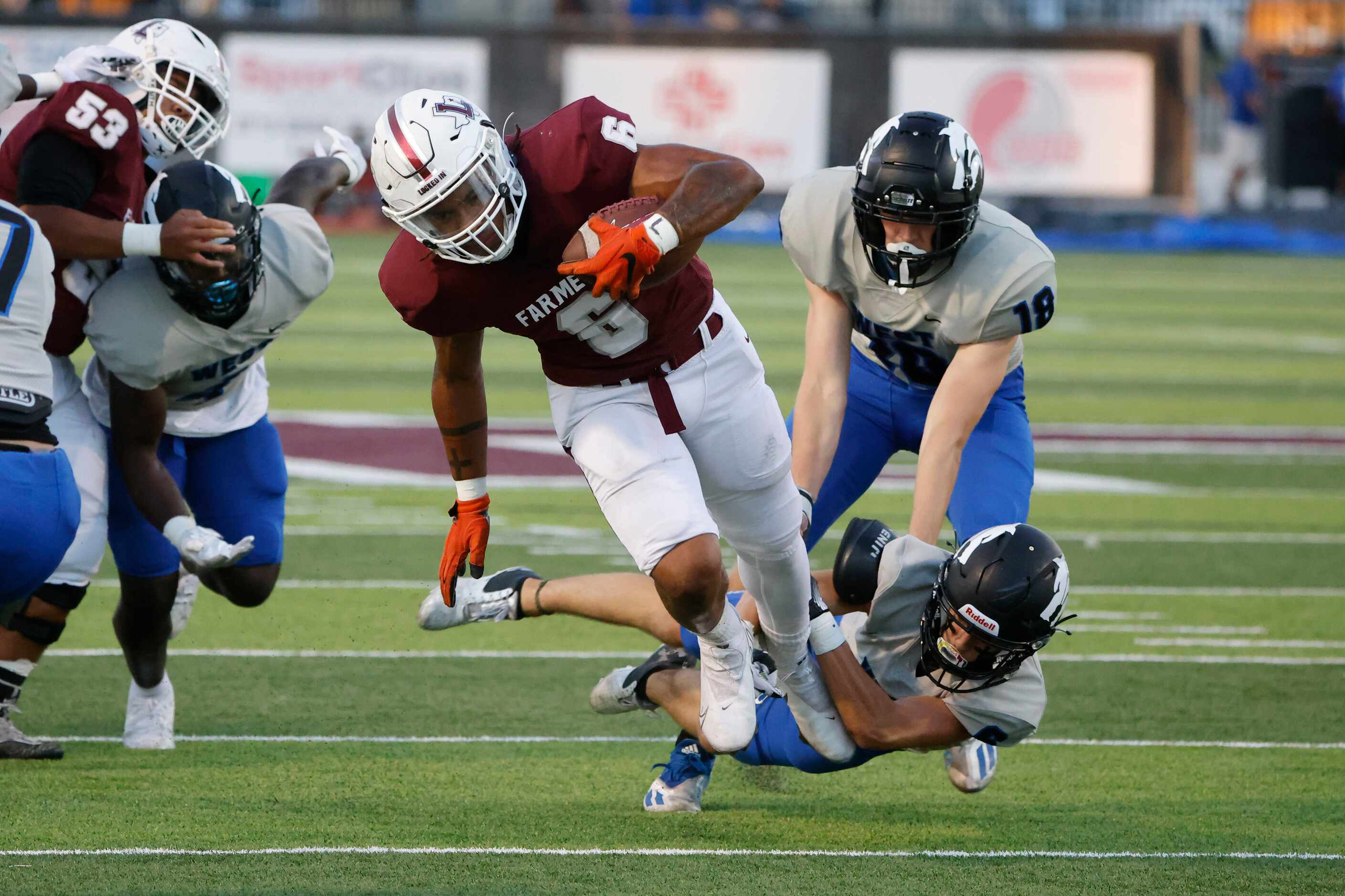 Lewisville running back Damien Martinez (6) runs out of an attempted tackle by Plano Wesd...