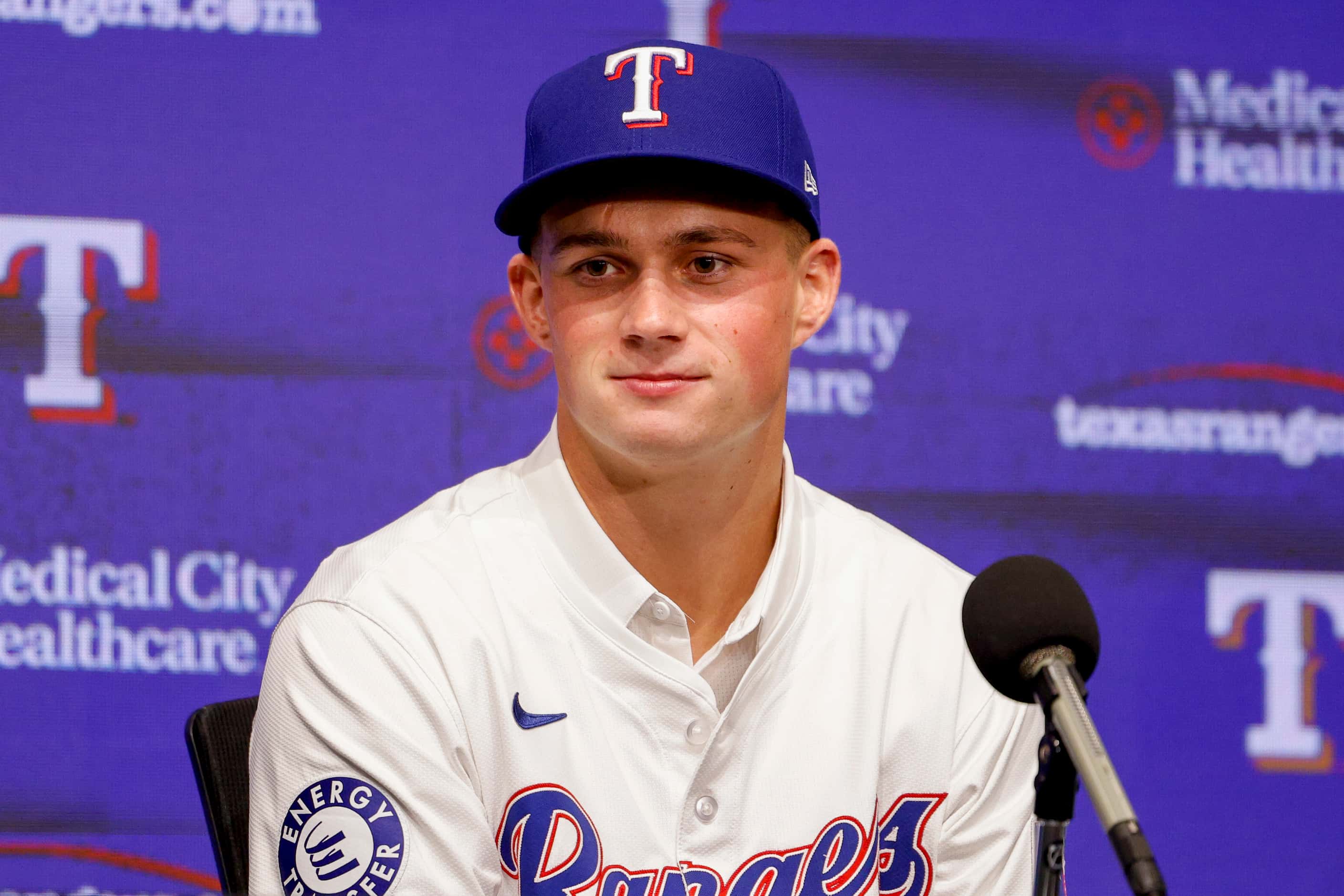 Texas Rangers first-round pick Malcolm Moore listens to questions during a press conference...