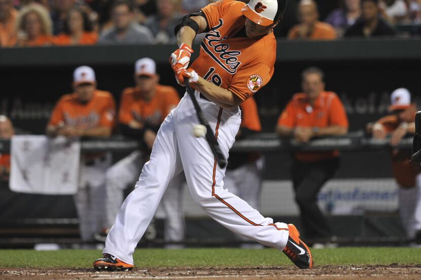 Baltimore Orioles' Chris Davis connects for a double against the Colorado Rockies in the...