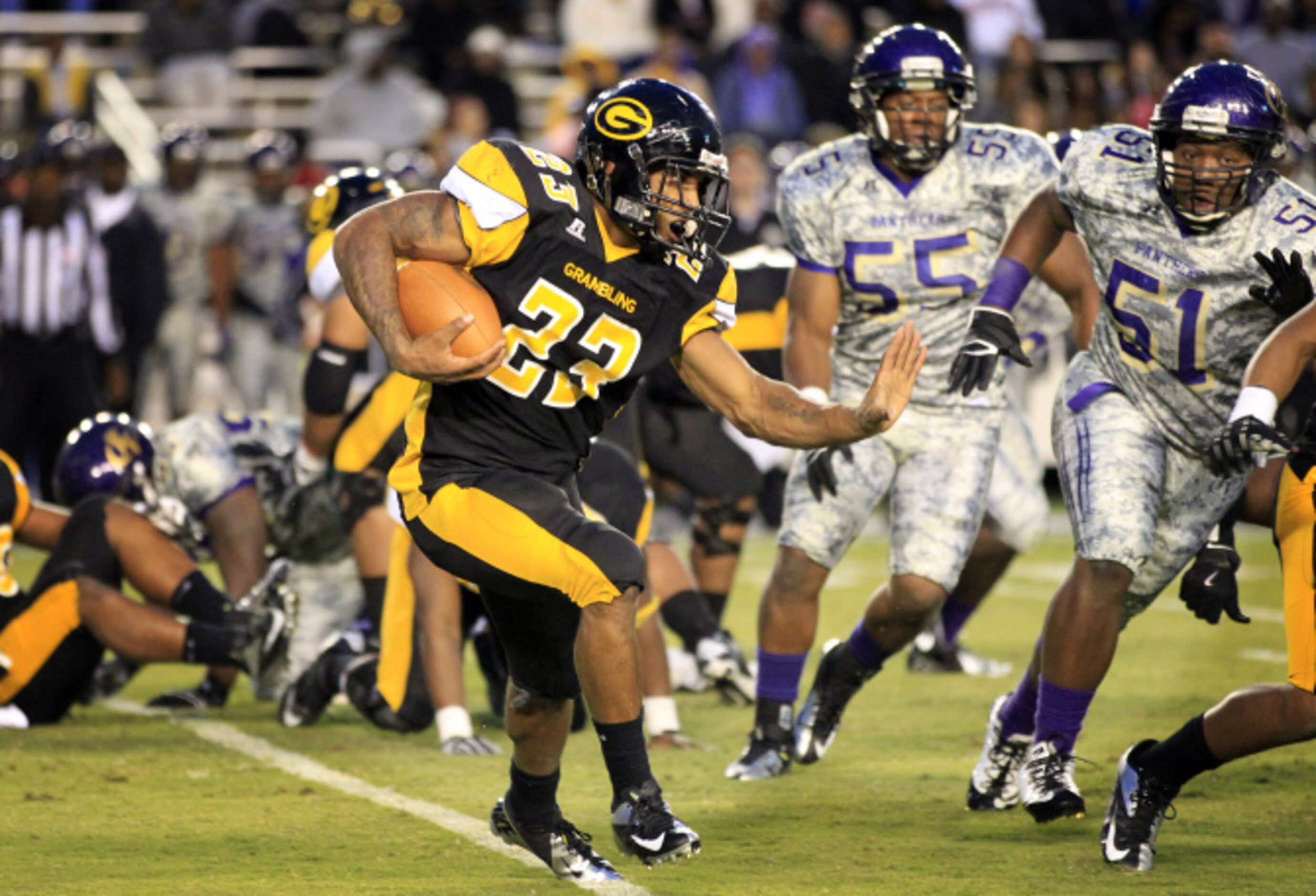 Grambling running back Cedric Skinner (23) looks for an opening to run through, as Prairie...