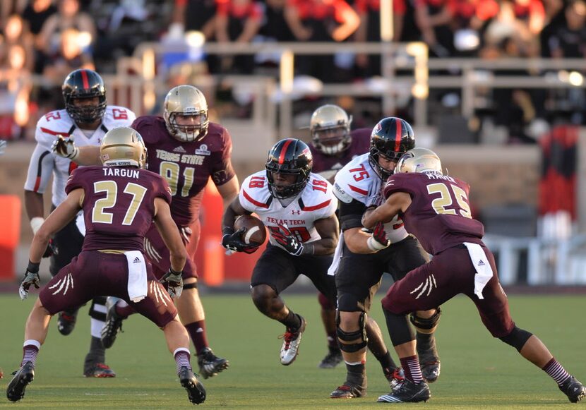 LUBBOCK, TX - SEPTEMBER 21: Eric Ward #18 of the Texas Tech Red Raiders rushes the ball into...