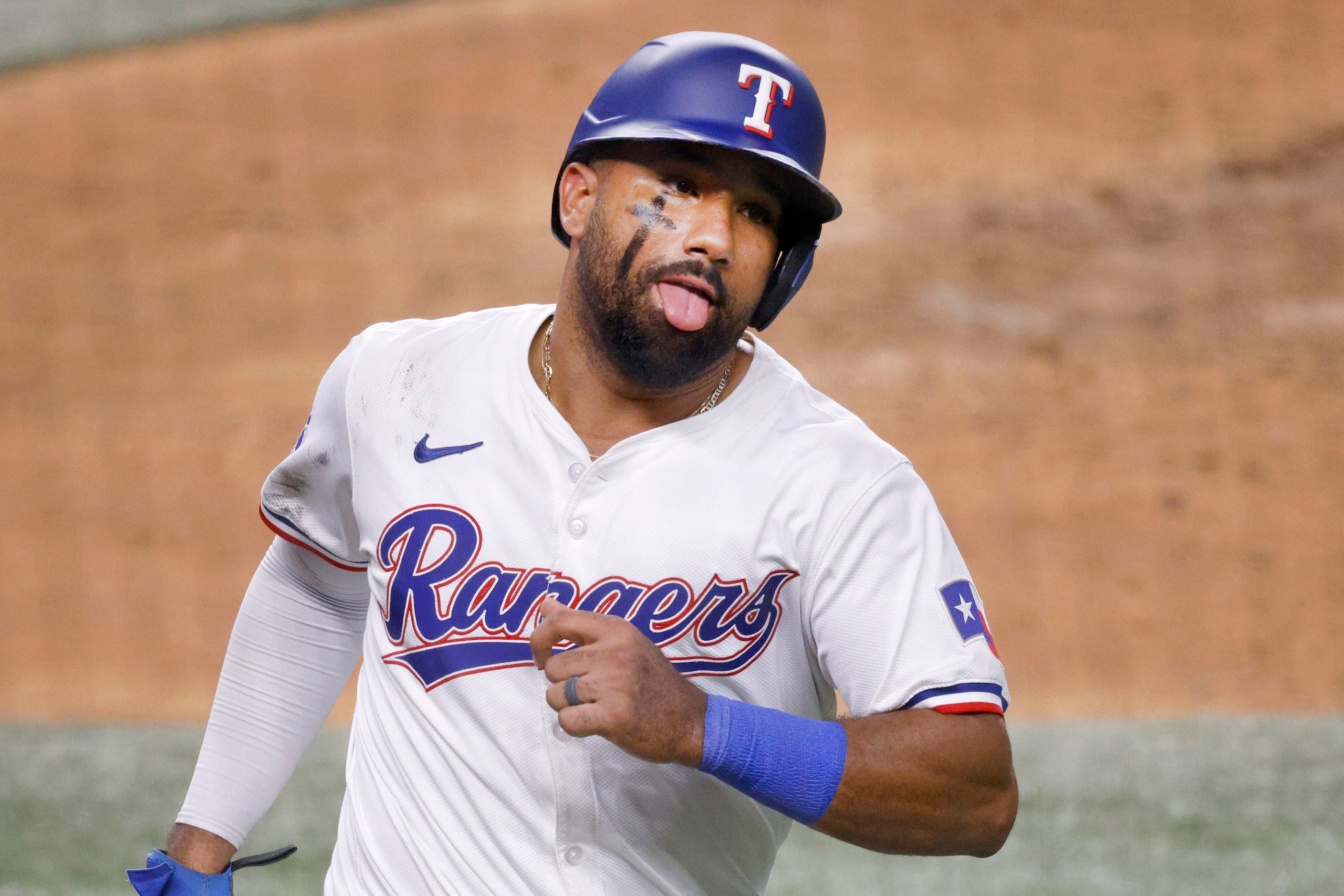 Texas Rangers’ Ezequiel Duran (20) reacts after scoring on a single by Texas Rangers’ Wyatt...