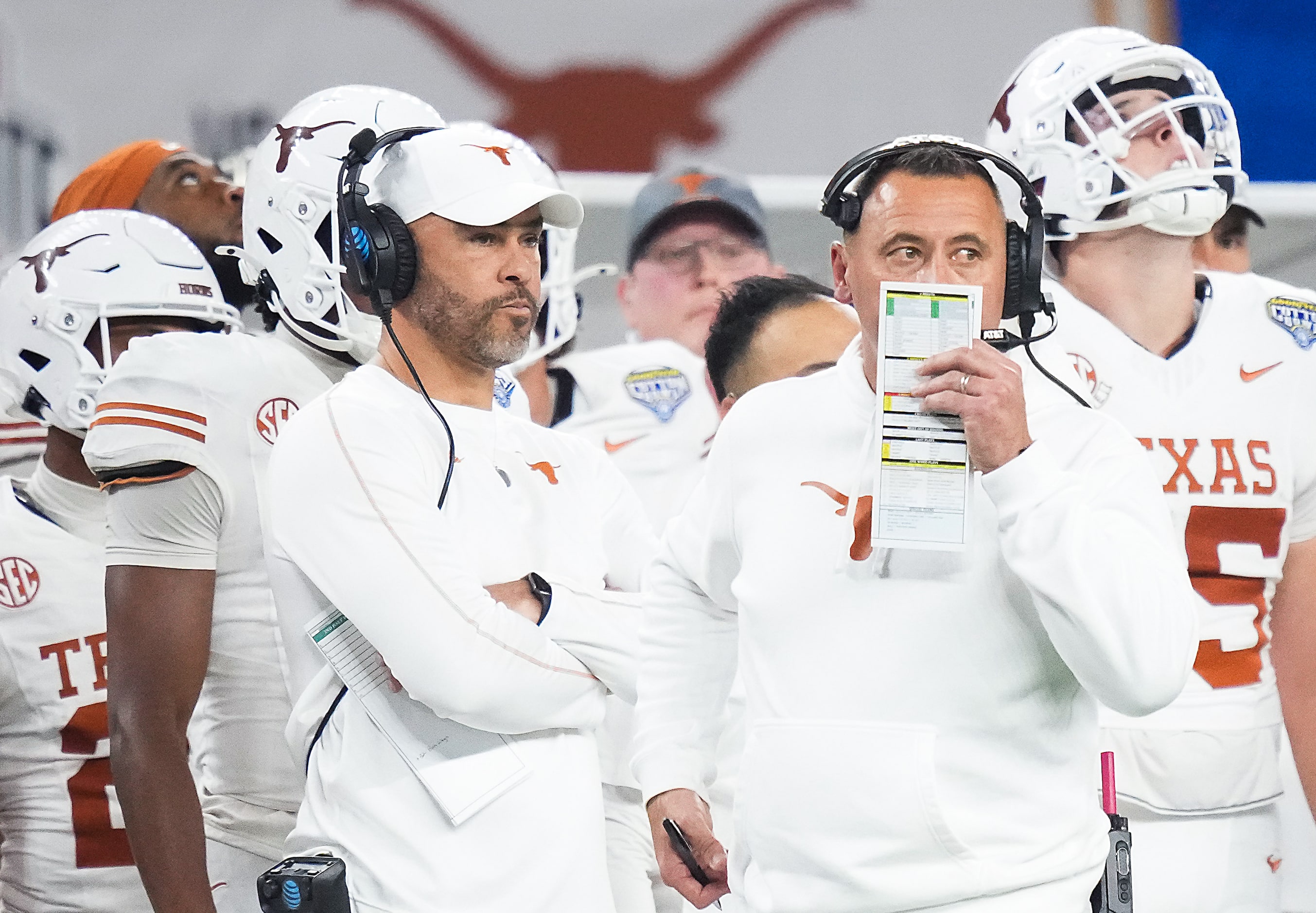 Texas head coach Steve Sarkisian works on the sidelines during the first half of the Cotton...