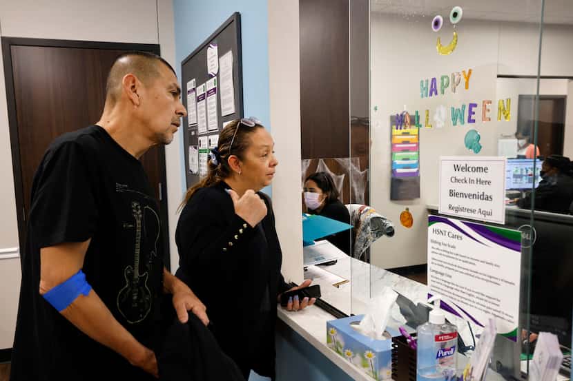 Salvador Hurtado of Denton and his wife Dina Jetzabel stop at the front desk and talk with...