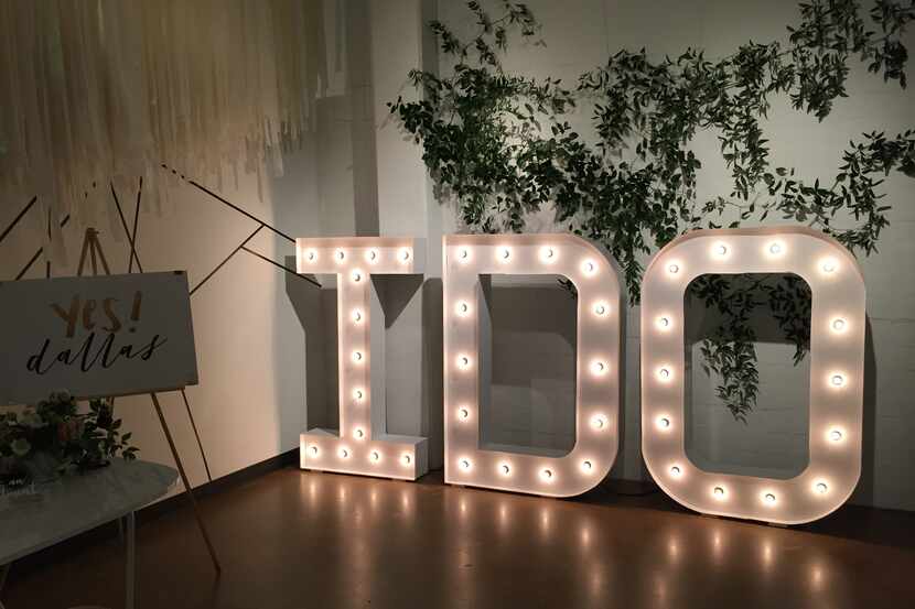At A&Bé's grand opening party, decorative signage put brides-to-be in the mood to find their...
