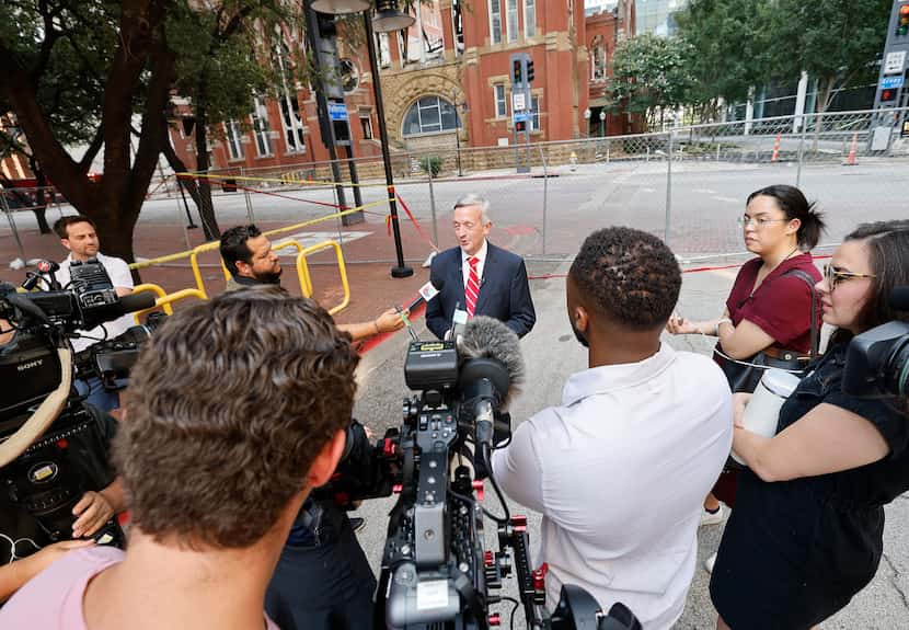 Robert Jeffress, senior pastor of First Baptist Dallas church speaks to reporters at the...