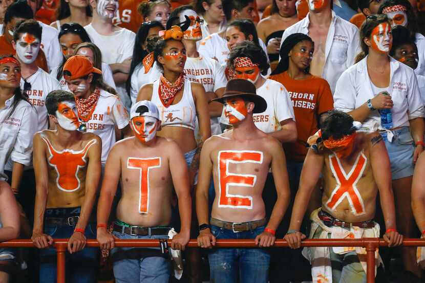 Texas fans react in the final minutes of Texas' loss to the LSU Tigers in a college football...