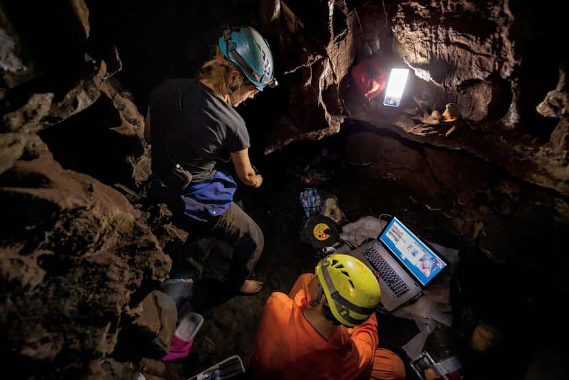 Anthropologist Marina Elliott  (left) and paleontologist Ashley Kruger explore a side...