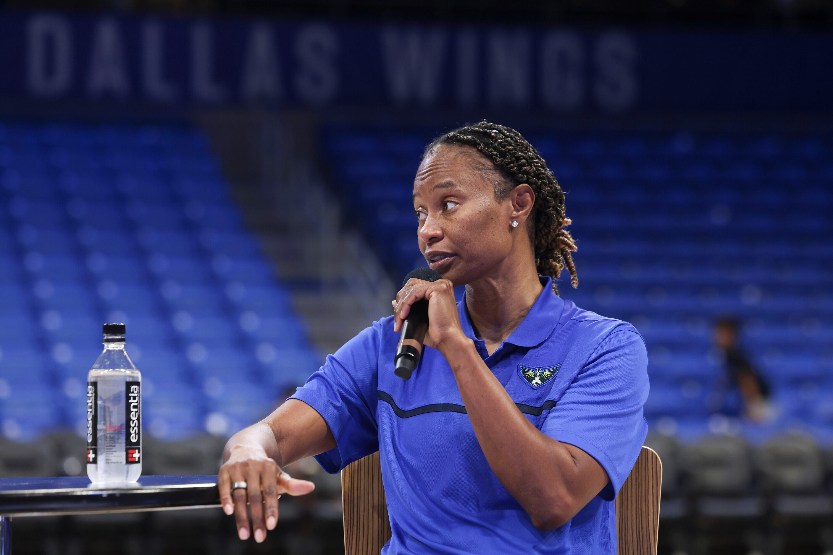 Vickie Johnson, Dallas Wings Head Coach, talks during a post-game panel on Inspiring Woman’s...