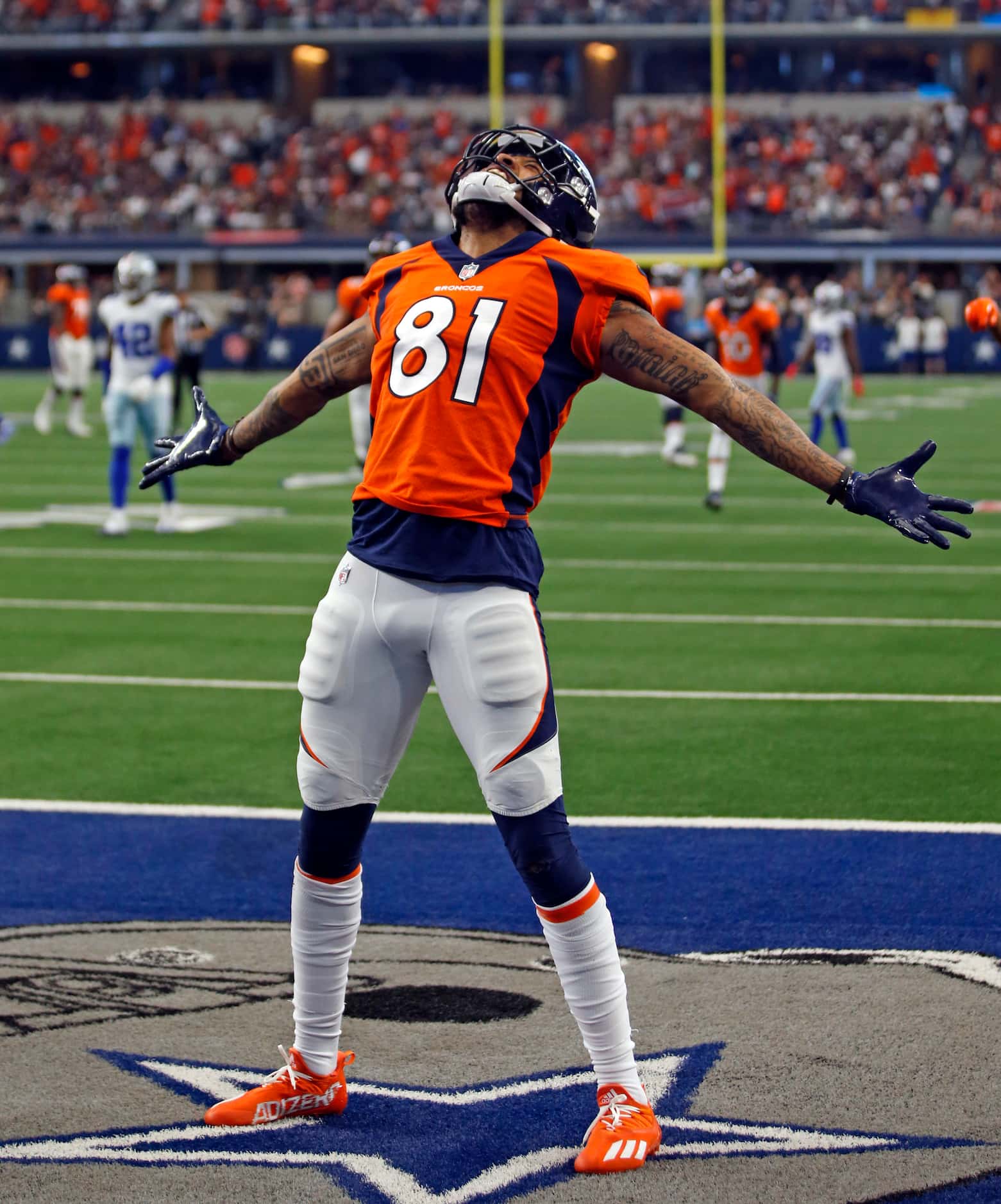 Denver Broncos wide receiver Tim Patrick (81) celebrates in the end zone after scoring a...