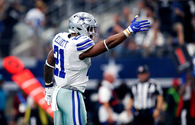 Dallas Cowboys running back Ezekiel Elliott (21) signals first down after making a big first...