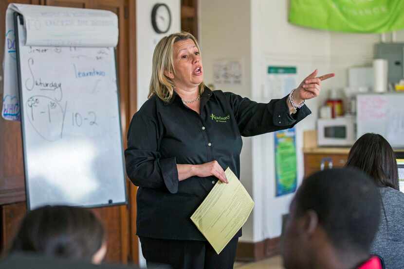
Denise Tucker, a finance teacher and director of the Finance Academy at Woodrow Wilson High...