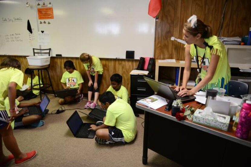 
Fourth-grade teacher Ashlyn Stratton-Smith guides students through an assignment. In its...