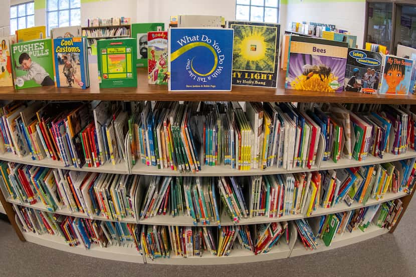 Books sit on shelves in an elementary school library in suburban Atlanta on Friday, 18,...