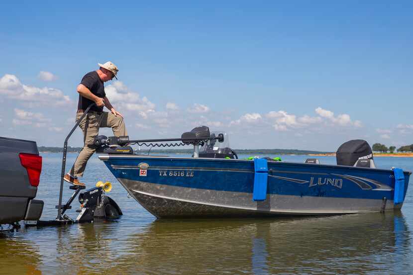 A man unloads his boat onto Grapevine Lake in this file photo. A number of boat ramps at the...