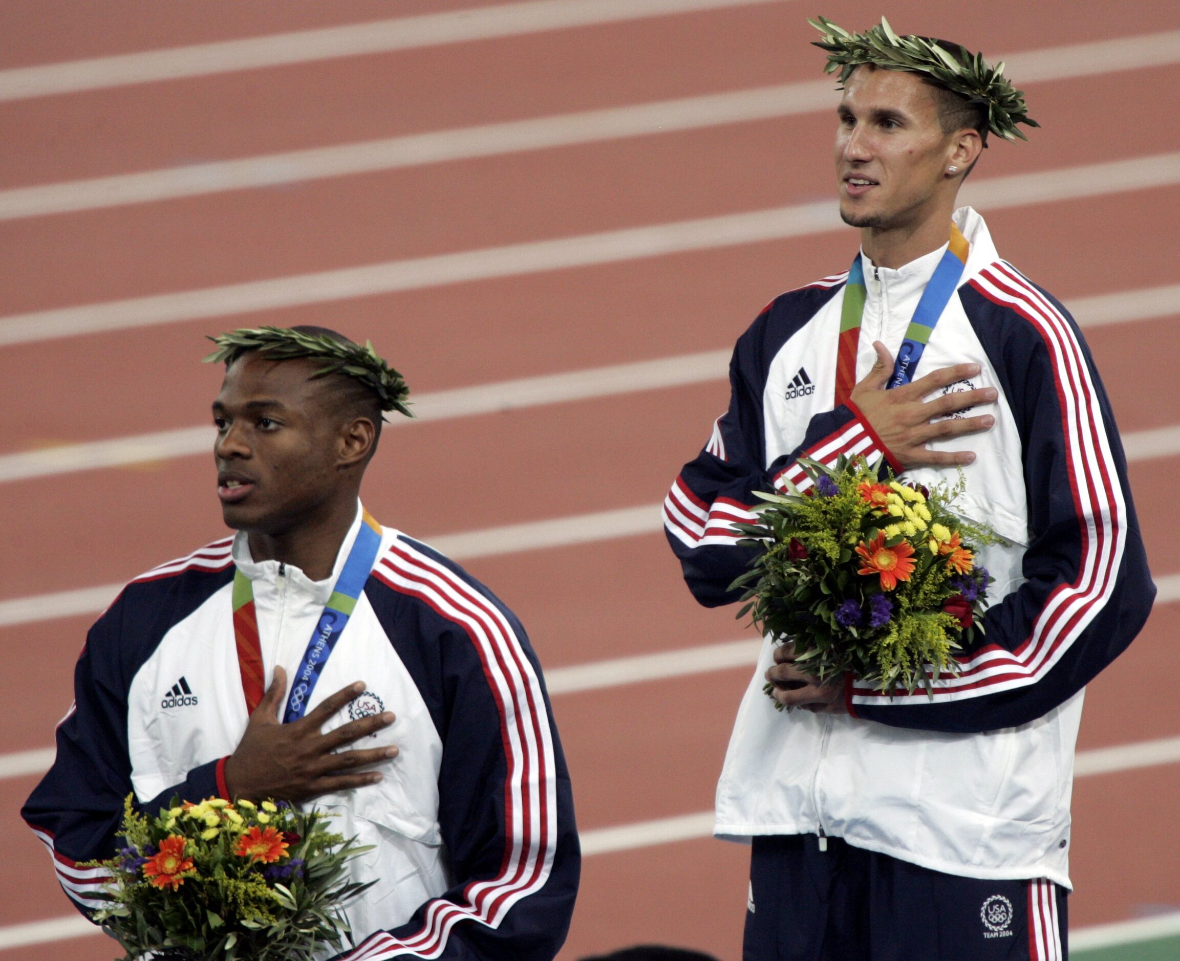 2004 Summer Olympic Games: Silver medalist Otis Harris (L) and gold medalist Jeremy Wariner...