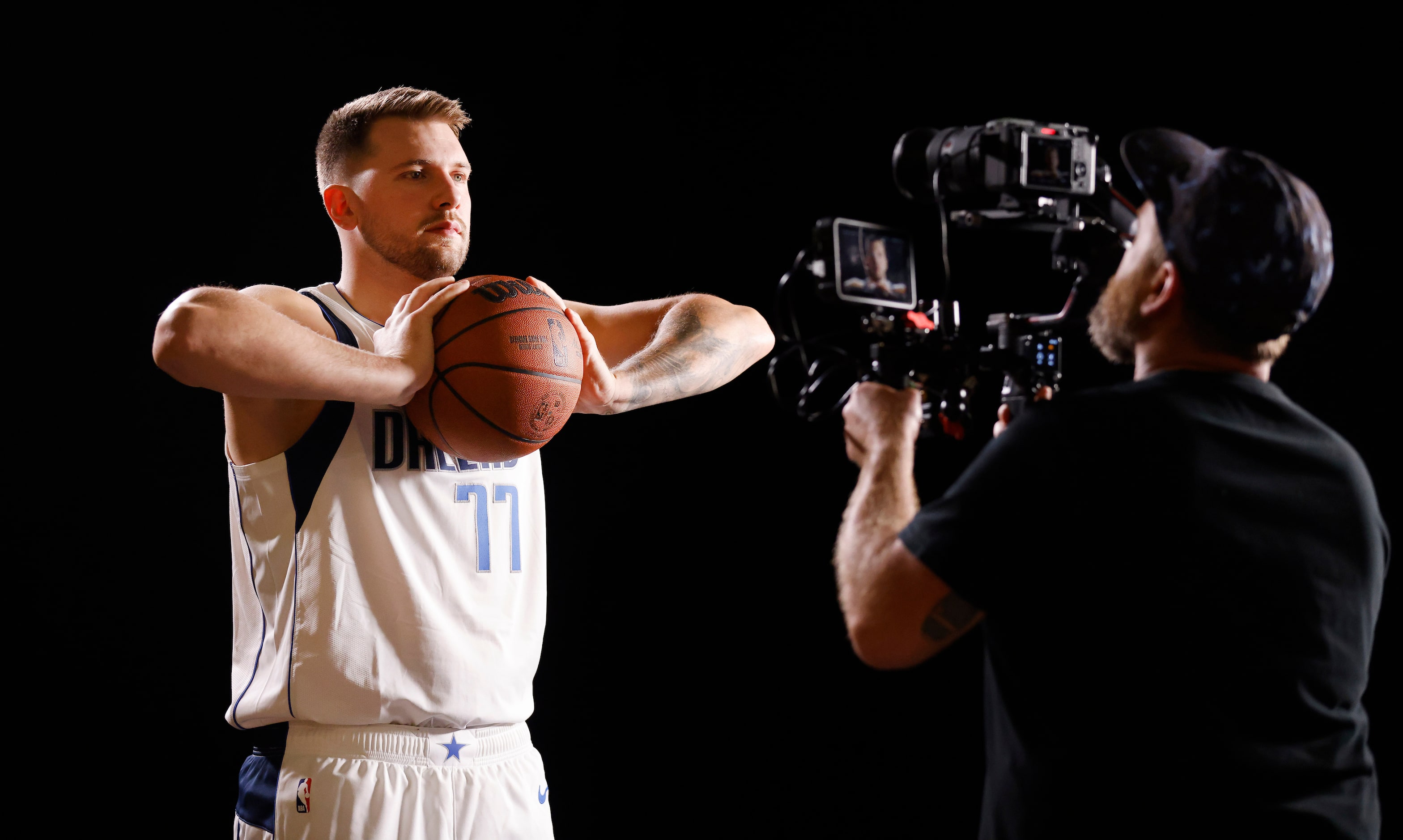 Dallas Mavericks guard Luka Doncic poses for creative producer Dalton Tarver who rolls video...