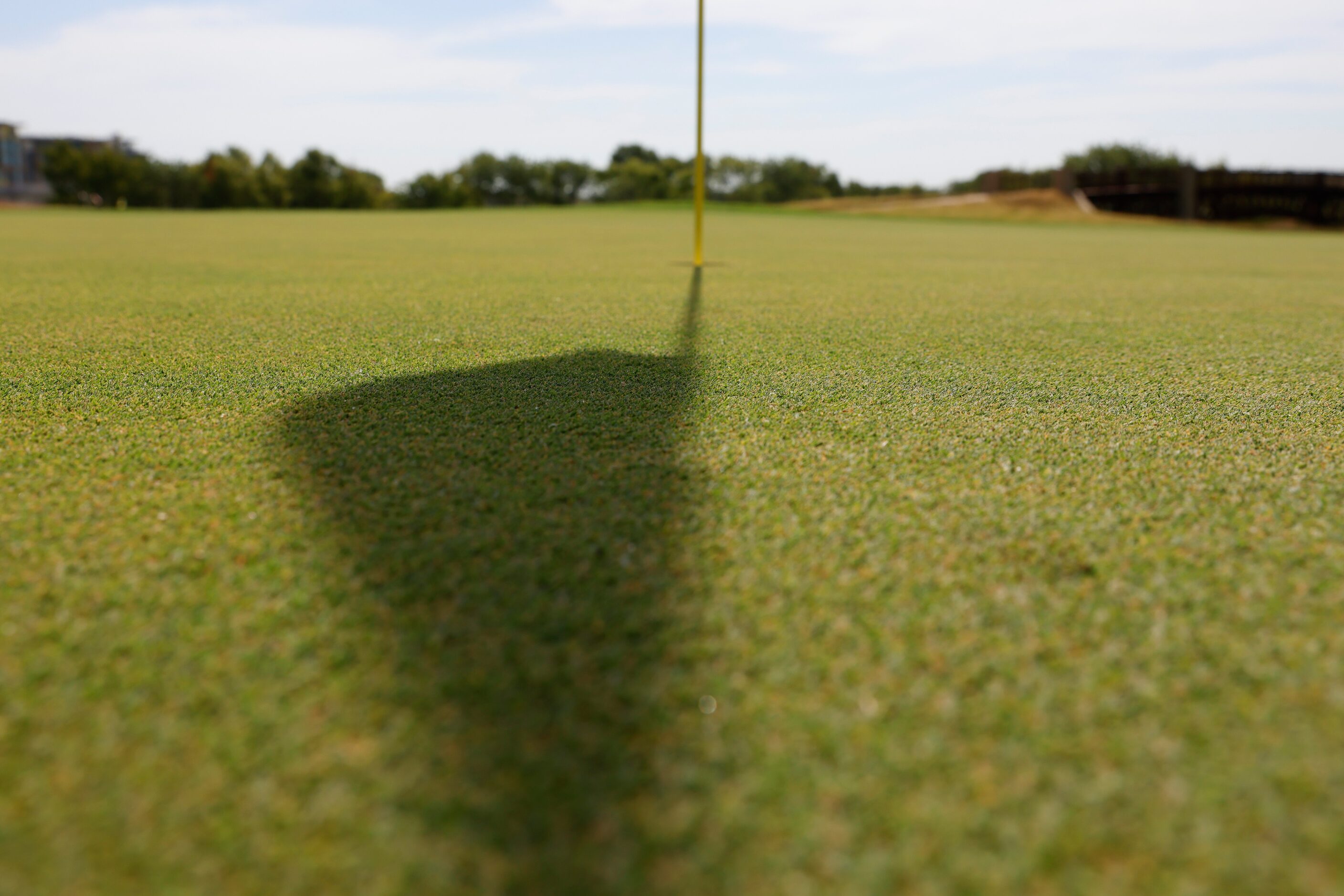 The shadow of the official flag of the 2023 KitchenAid Senior PGA Championship casted on the...