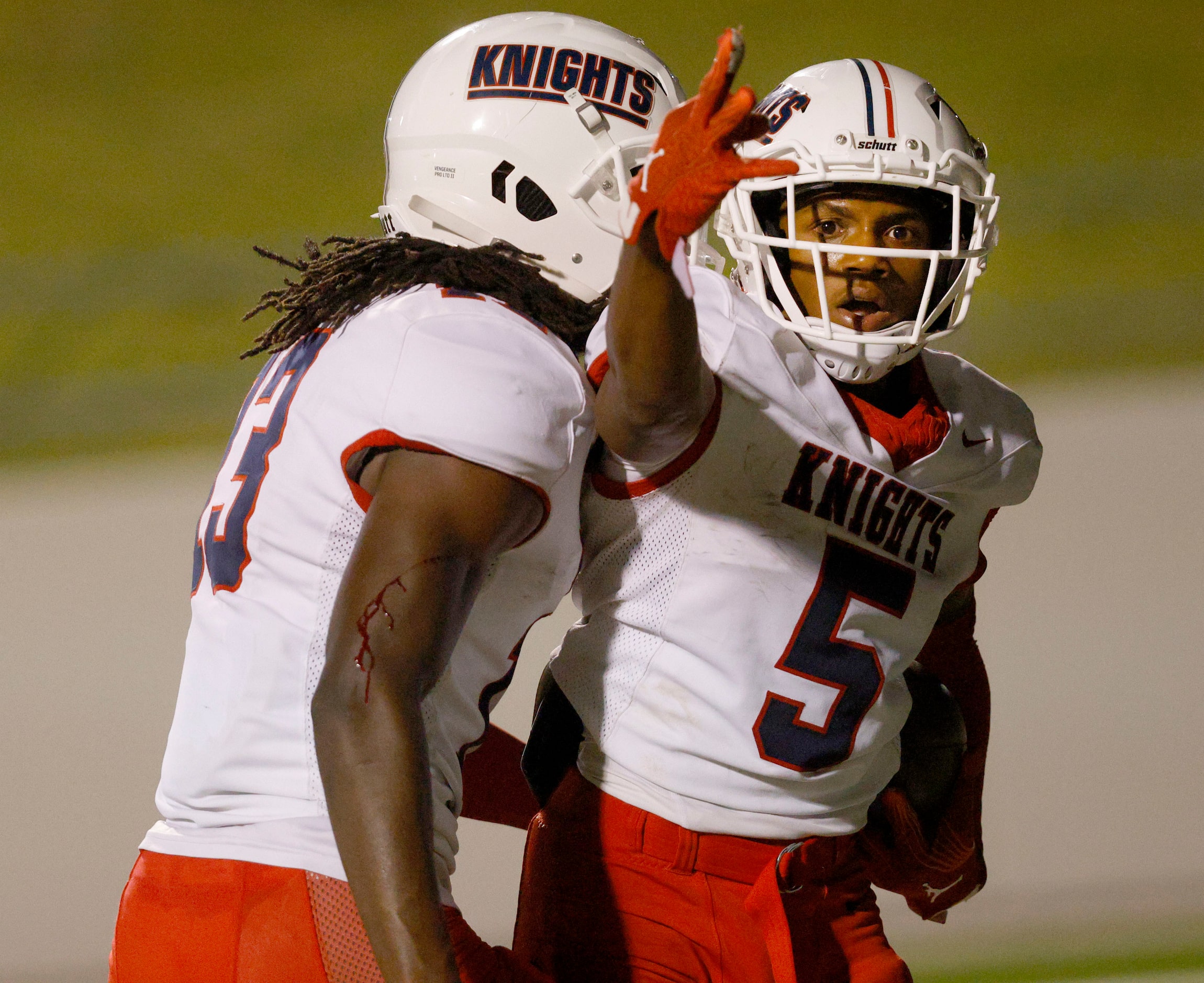 Kimball's Camrin Jackson (5) celebrates with his teammate Terry Barber (13) after scoring a...