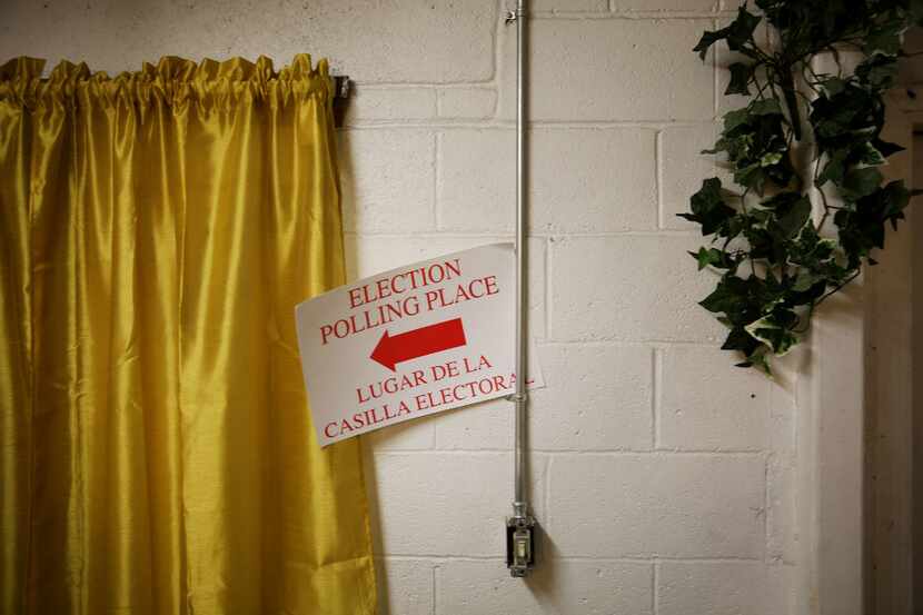 An election polling place sign hangs while setting up voting precinct 3045 at Gethsemane...