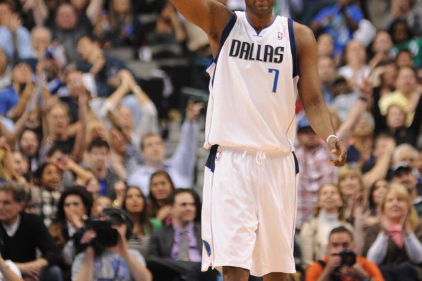 Dallas Mavericks power forward Lamar Odom (7) raises his hand after a three point basket....