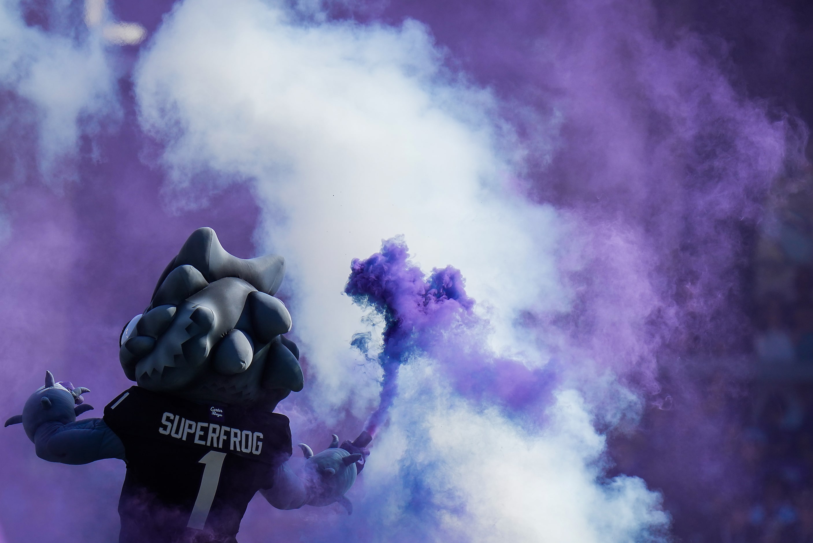 The TCU mascot fires up the crowd before an NCAA football game against Texas Tech on...