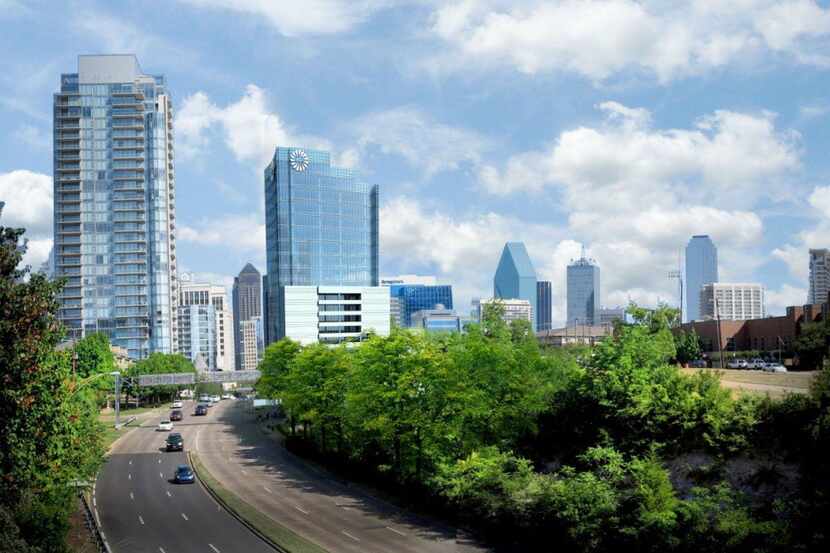 Developer Harwood International's new 22-story Frost Tower, with the round sign on top, will...